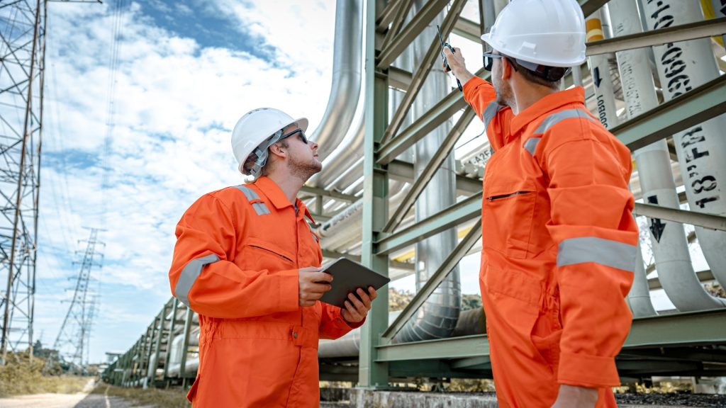 Engineer using laptop for predictive maintenance analysis