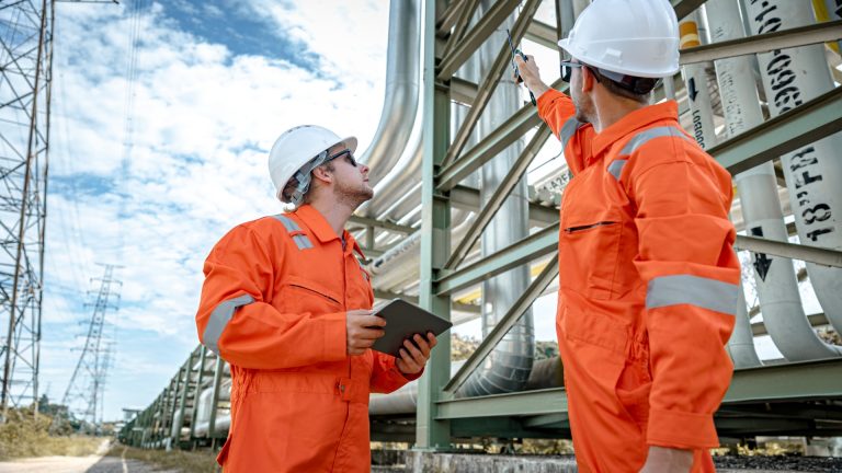Engineer using laptop for predictive maintenance analysis